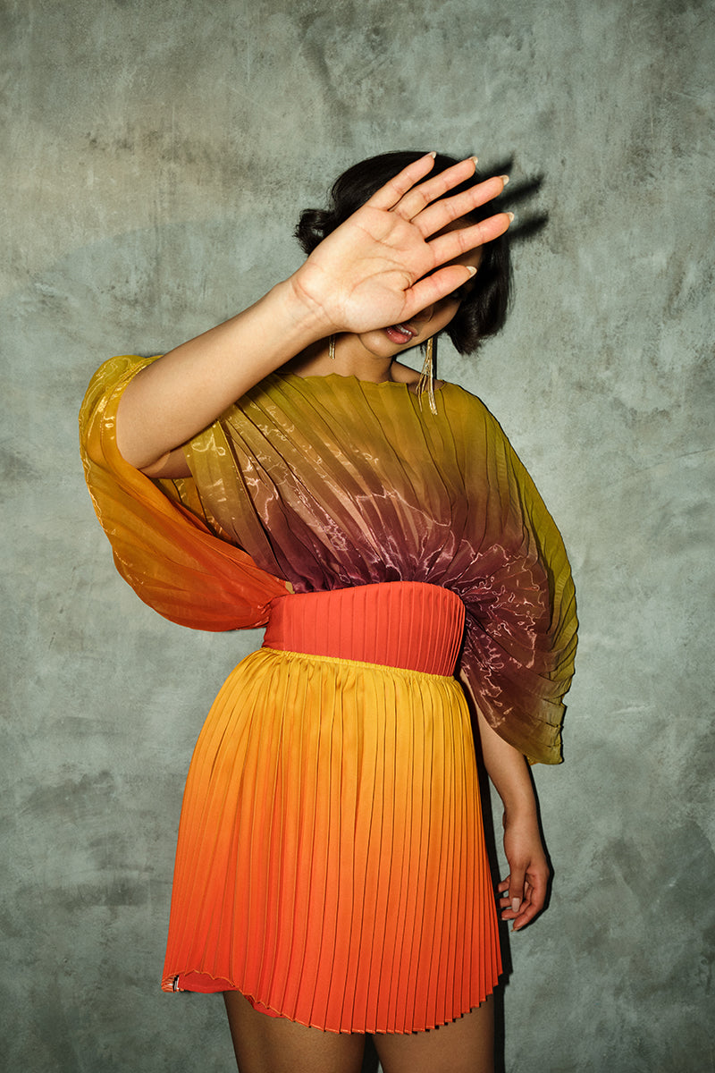 KATA PLEATED MINI SKIRT IN ADWA RED PRINT